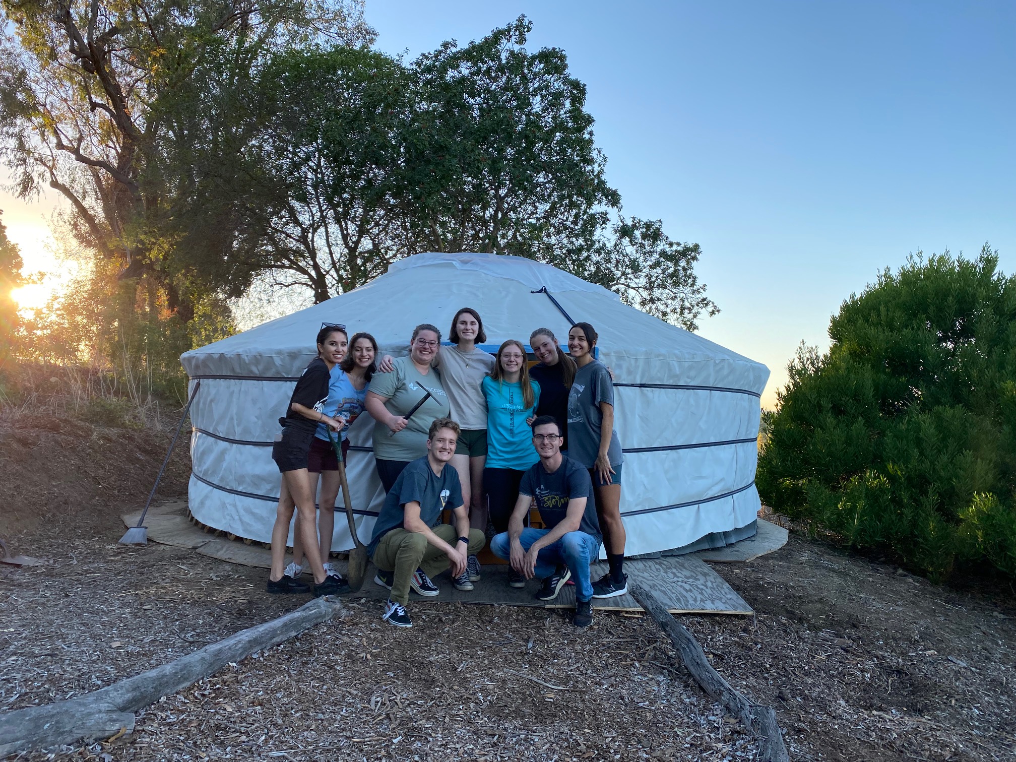 Student posing for a photo in front of the Mongolian Ger
